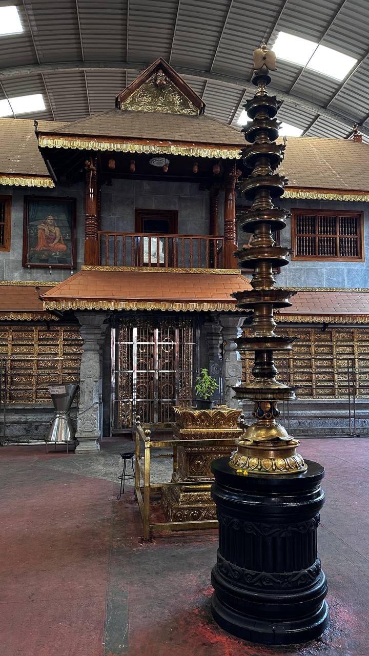 Ornate temple interior with brass lamp