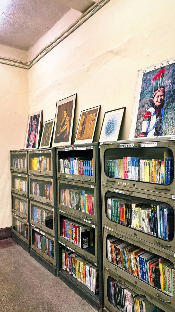 Library shelves with books and artwork