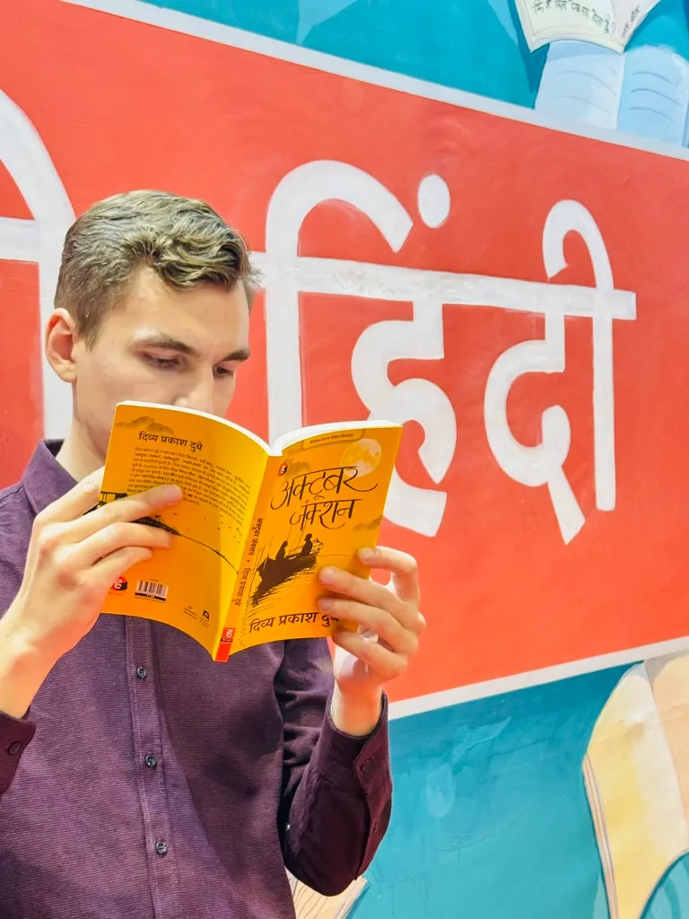 Reading a Hindi book at the Delhi Book Fair