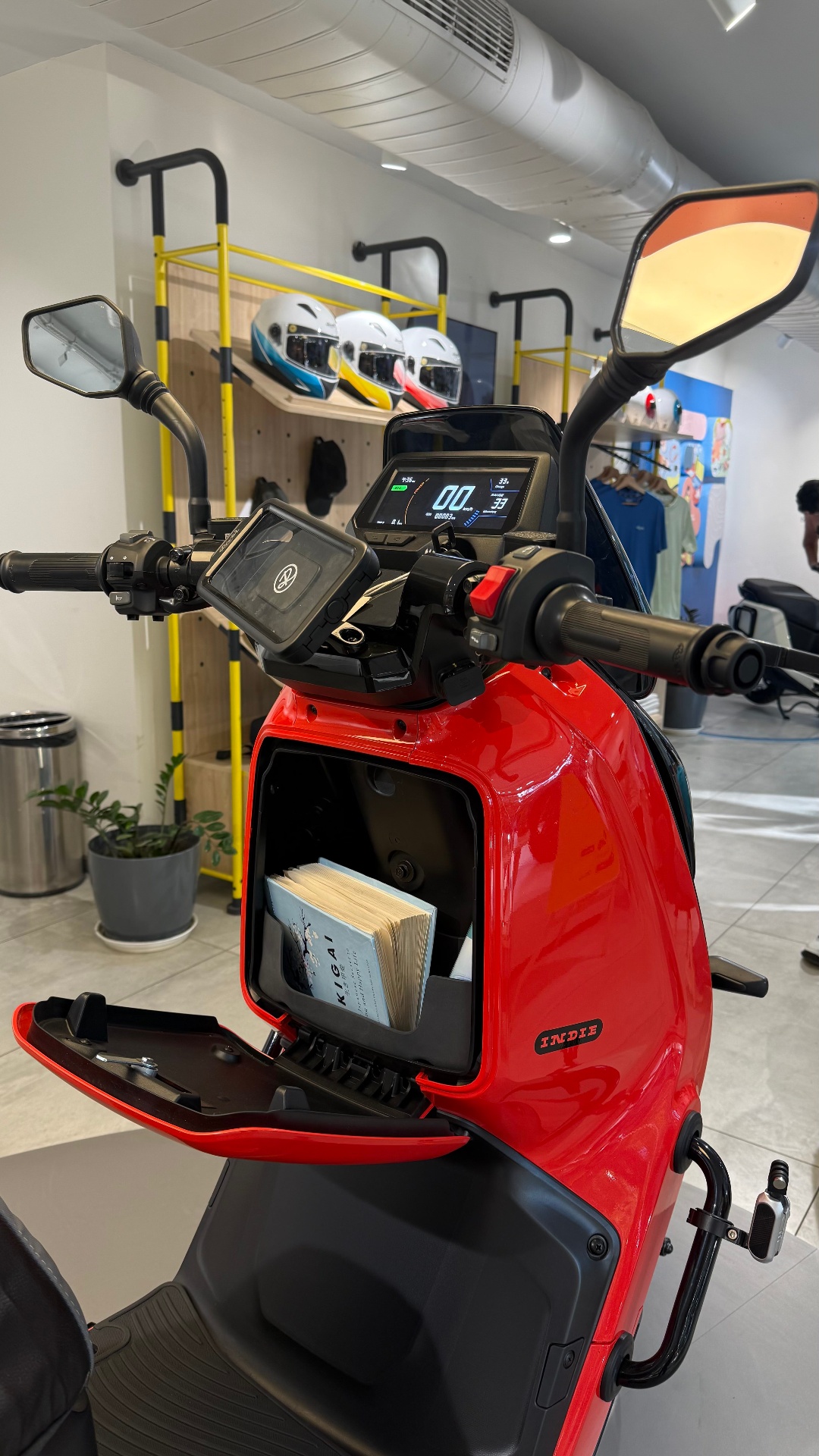 Red River Indie electric scooter with front storage compartment open