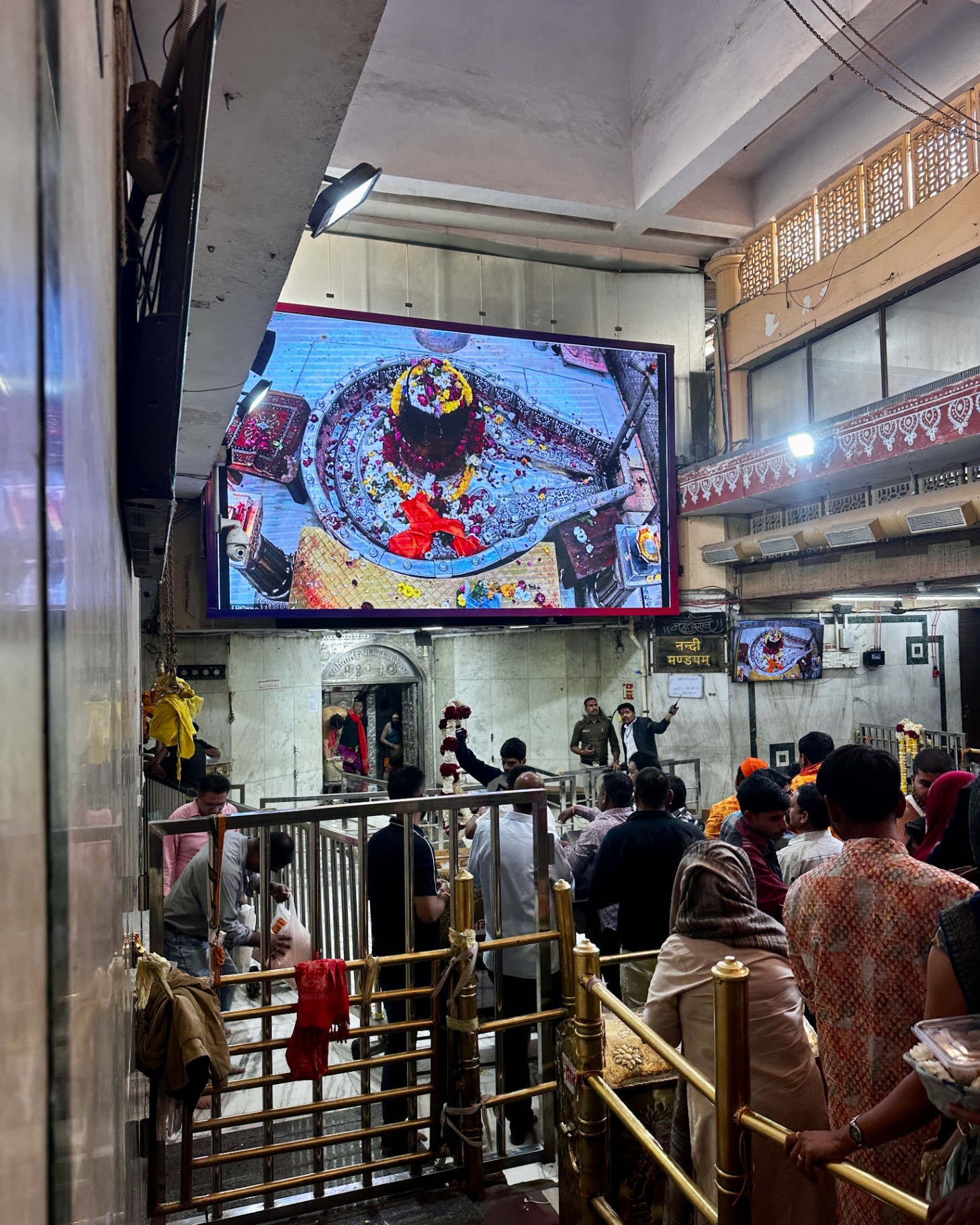 Interior of Mahakaleshwar temple showing the sacred lingam on screen