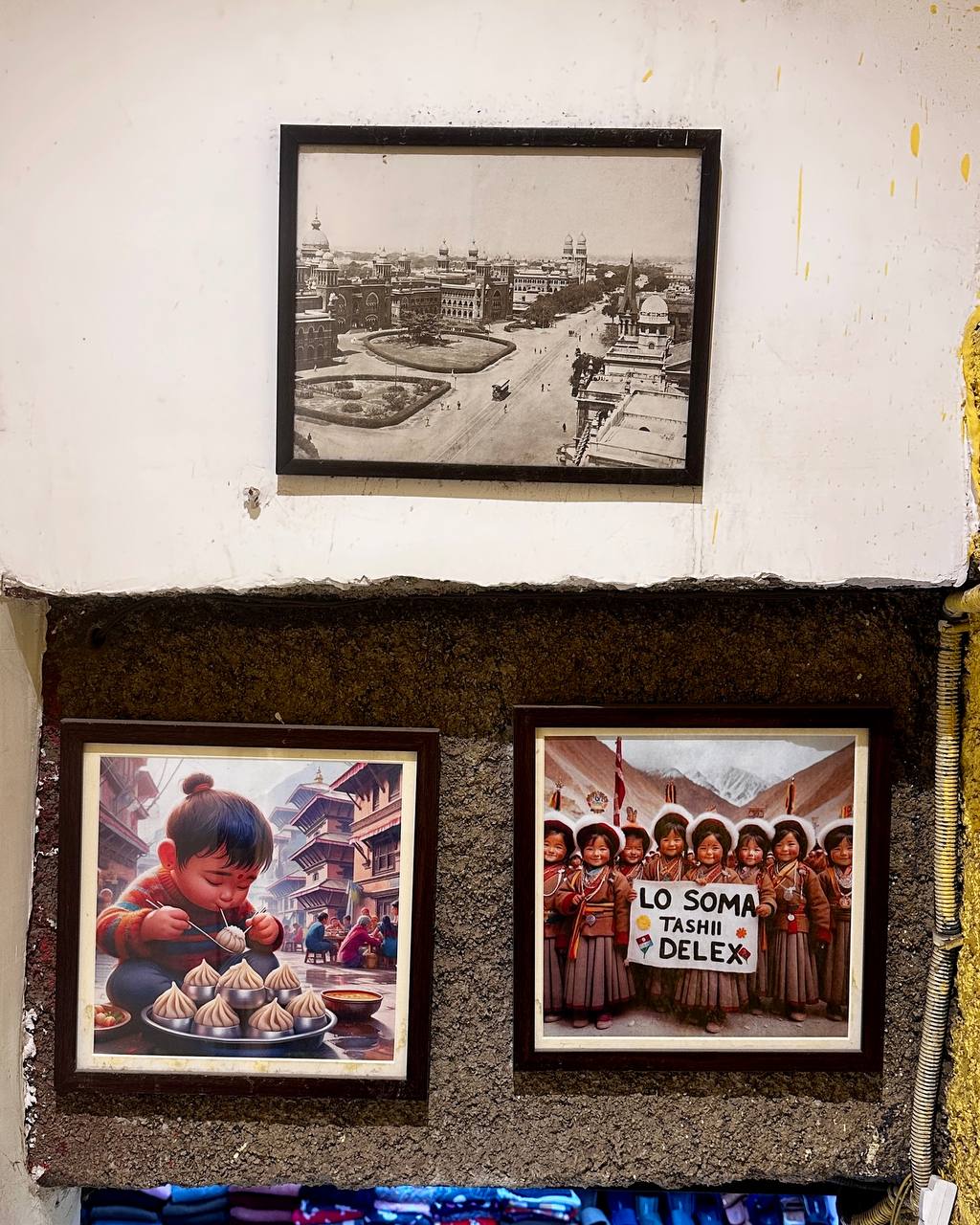 Framed photographs and art on walls of Majnu Ka Tilla
