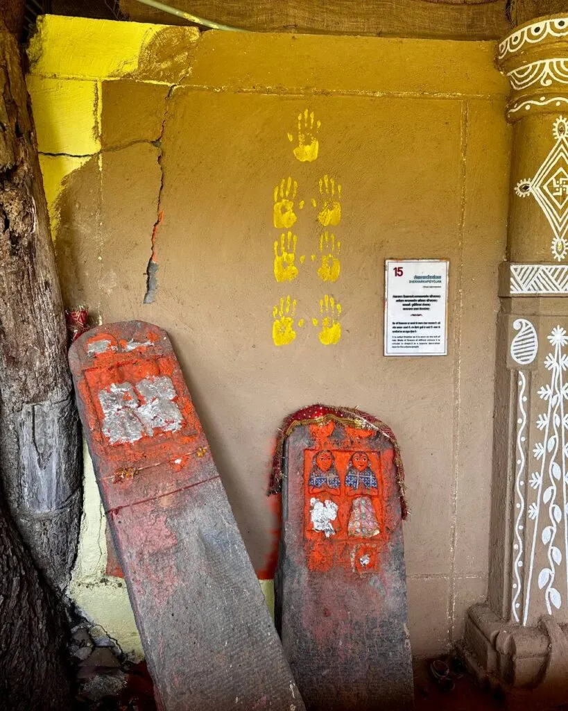 Sacred stones with vermillion and handprints